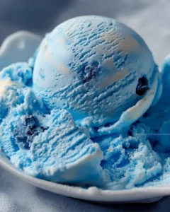 Homemade Blue Moon Ice Cream in a bowl with a spoon