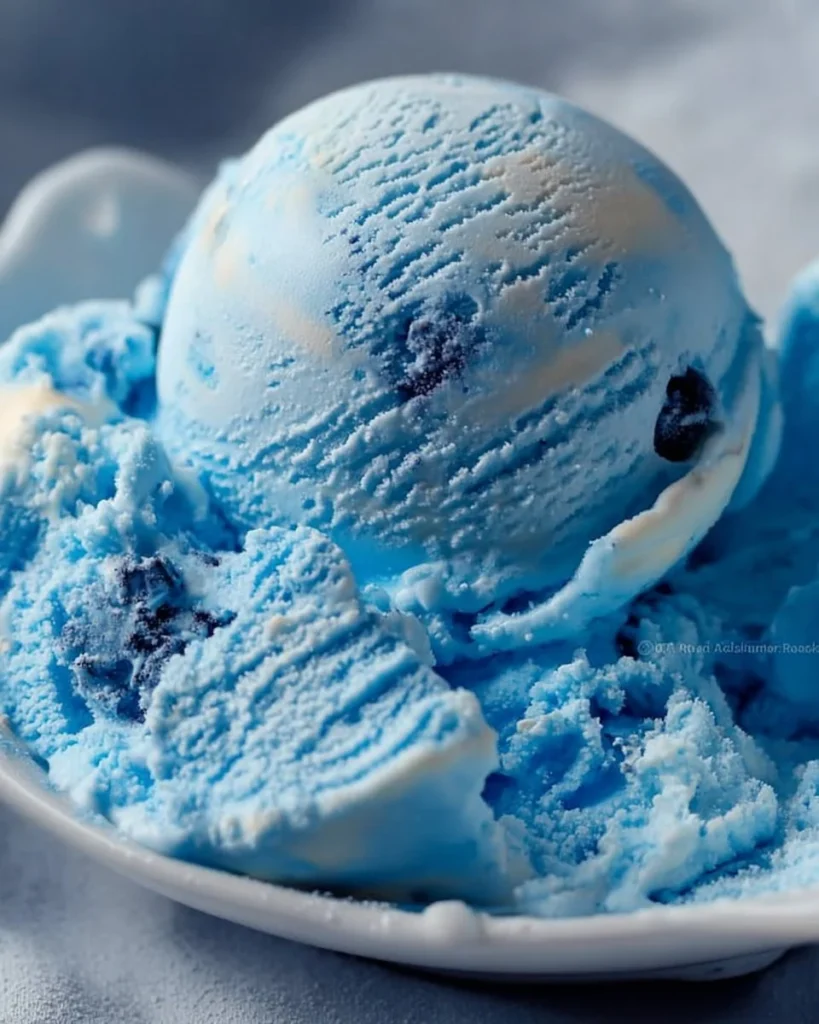 Homemade Blue Moon Ice Cream in a bowl with a spoon