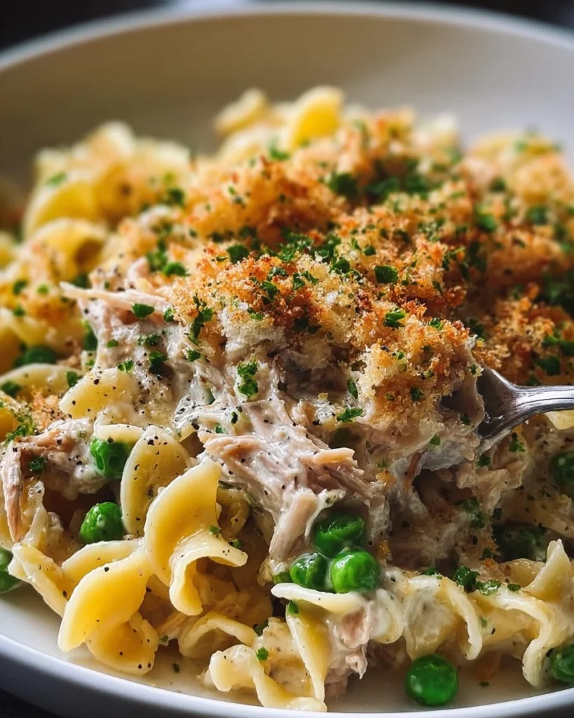Delicious homemade tuna noodle casserole served in a baking dish.