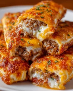 Cheesy taco sticks served on a plate with toppings.