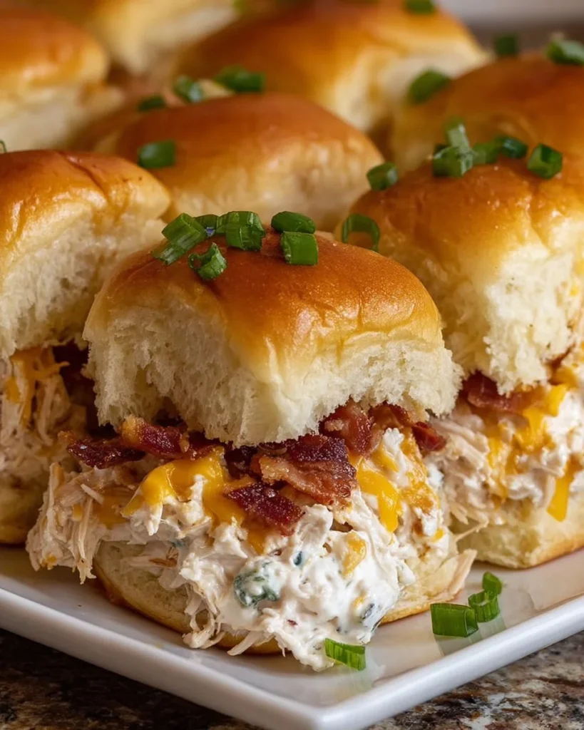 Delicious Crack Chicken Sliders served with toppings on a plate
