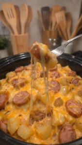 Creamy cheesy beef sausage dish with potatoes, freshly prepared and served.