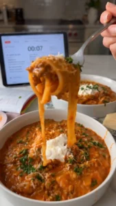 One Pan Lasagne Soup made with pasta, cheese, and rich tomato broth